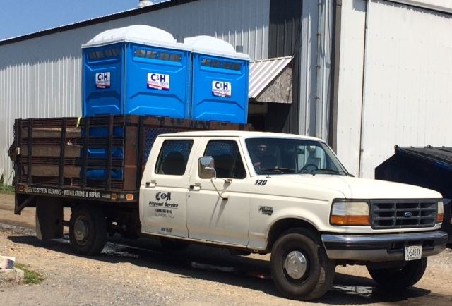 Portable toilets being delivered to client