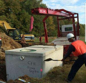 C & H Disposal Service, Inc. team installing new septic tank for client 